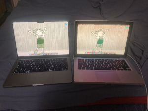 Two Macbooks, one new M1 Pro Macbook from 2021, and one old Macbook Pro from 2012.