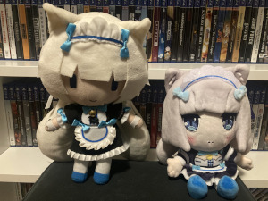 Two plushies of the same character: Vanilla from Nekopara, a white-haired catgirl wearing a maid outfit.